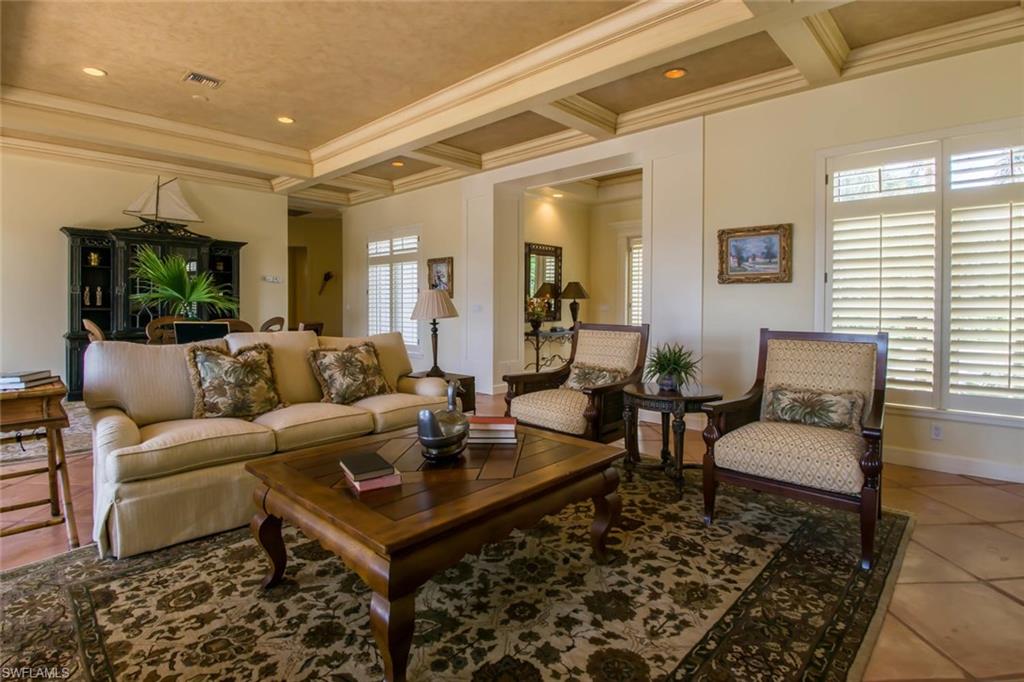 524 Turtle Hatch Road Naples, FL 34103 - Photo 12 of 24 a living room with furniture and a rug