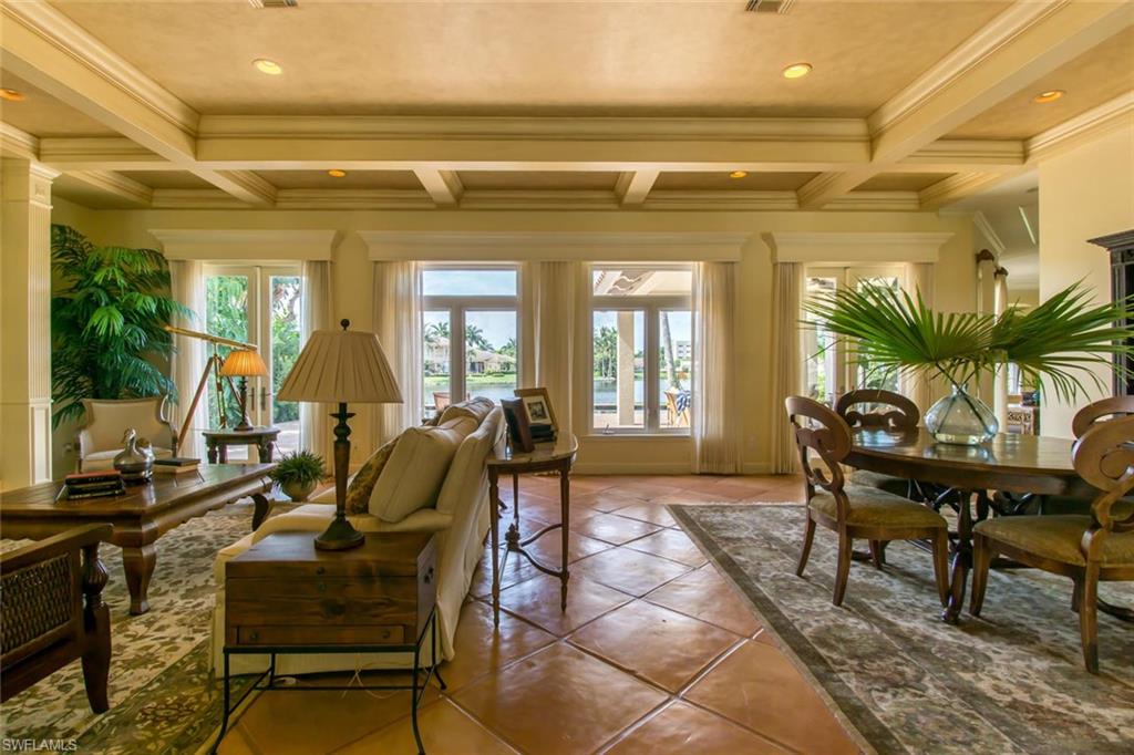 524 Turtle Hatch Road Naples, FL 34103 - Photo 13 of 24 a living room with furniture and a potted plant