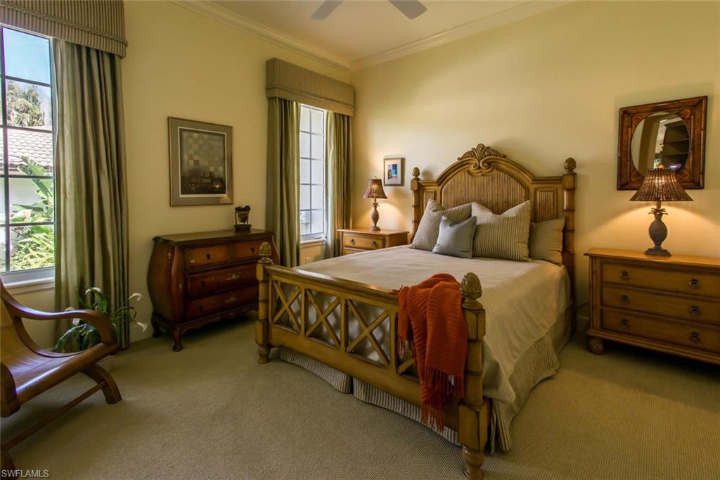 524 Turtle Hatch Road Naples, FL 34103 - Photo 20 of 24 a bed room with a bed and a tv