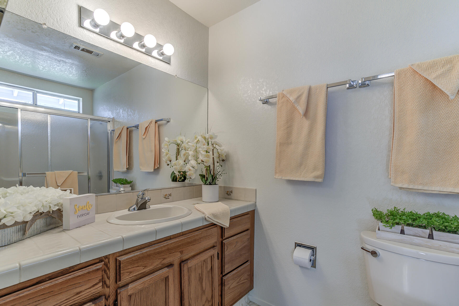 649 Lowe Street Redding, CA 96001 - Photo 12 of 35 a bathroom with a sink double vanity and a mirror