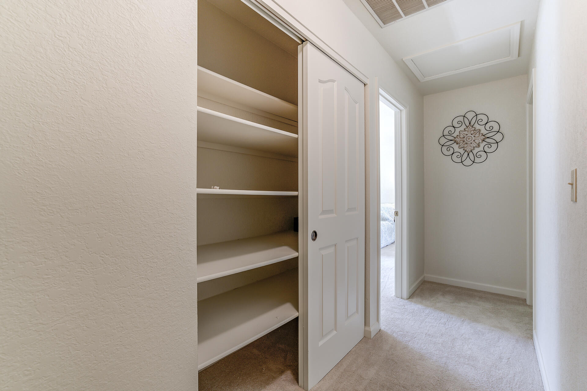 649 Lowe Street Redding, CA 96001 - Photo 16 of 35 a view of walk in closet with empty racks