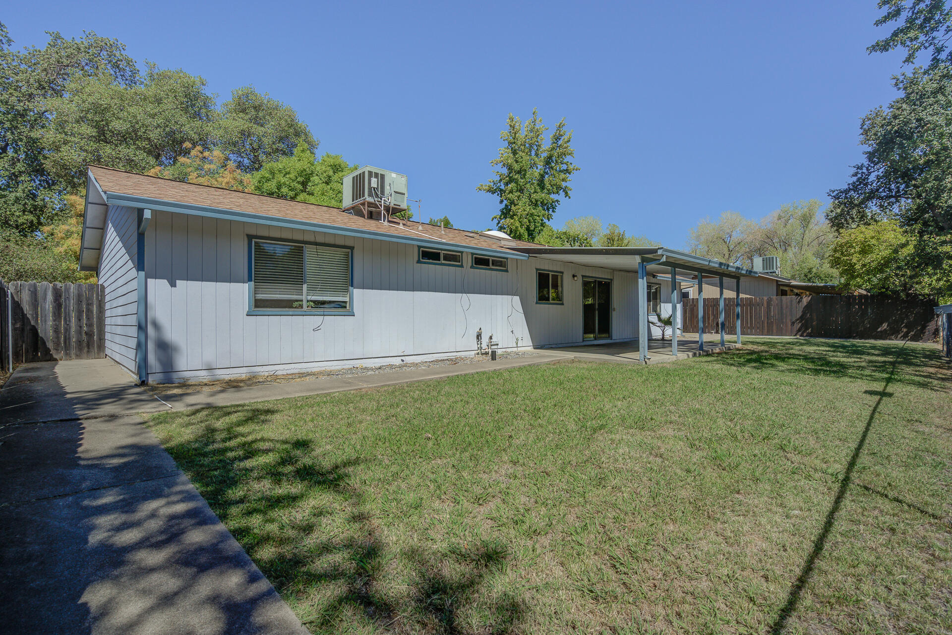 649 Lowe Street Redding, CA 96001 - Photo 22 of 35 a front view of a house with a garden