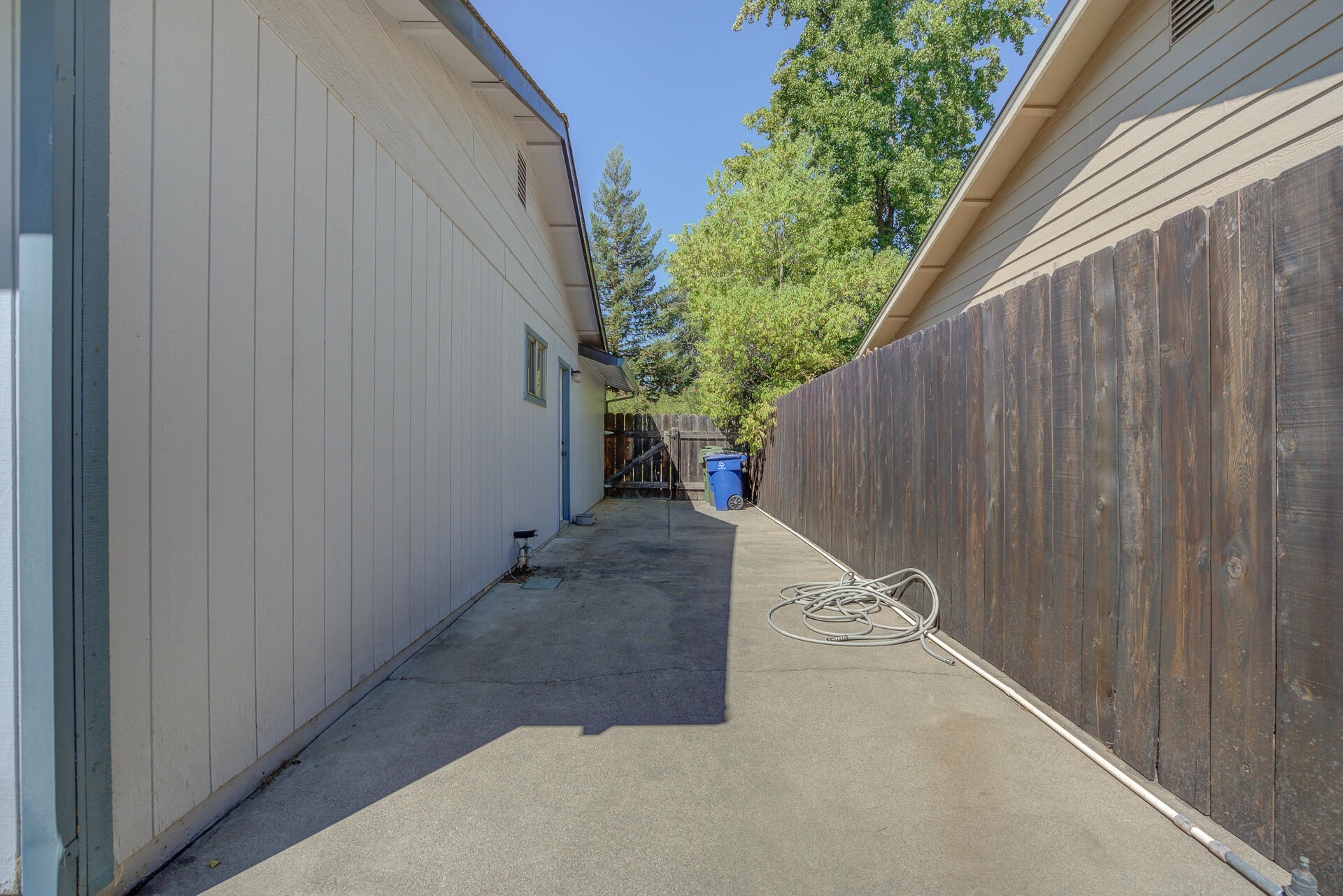 649 Lowe Street Redding, CA 96001 - Photo 24 of 35 a view of a backyard with pathway