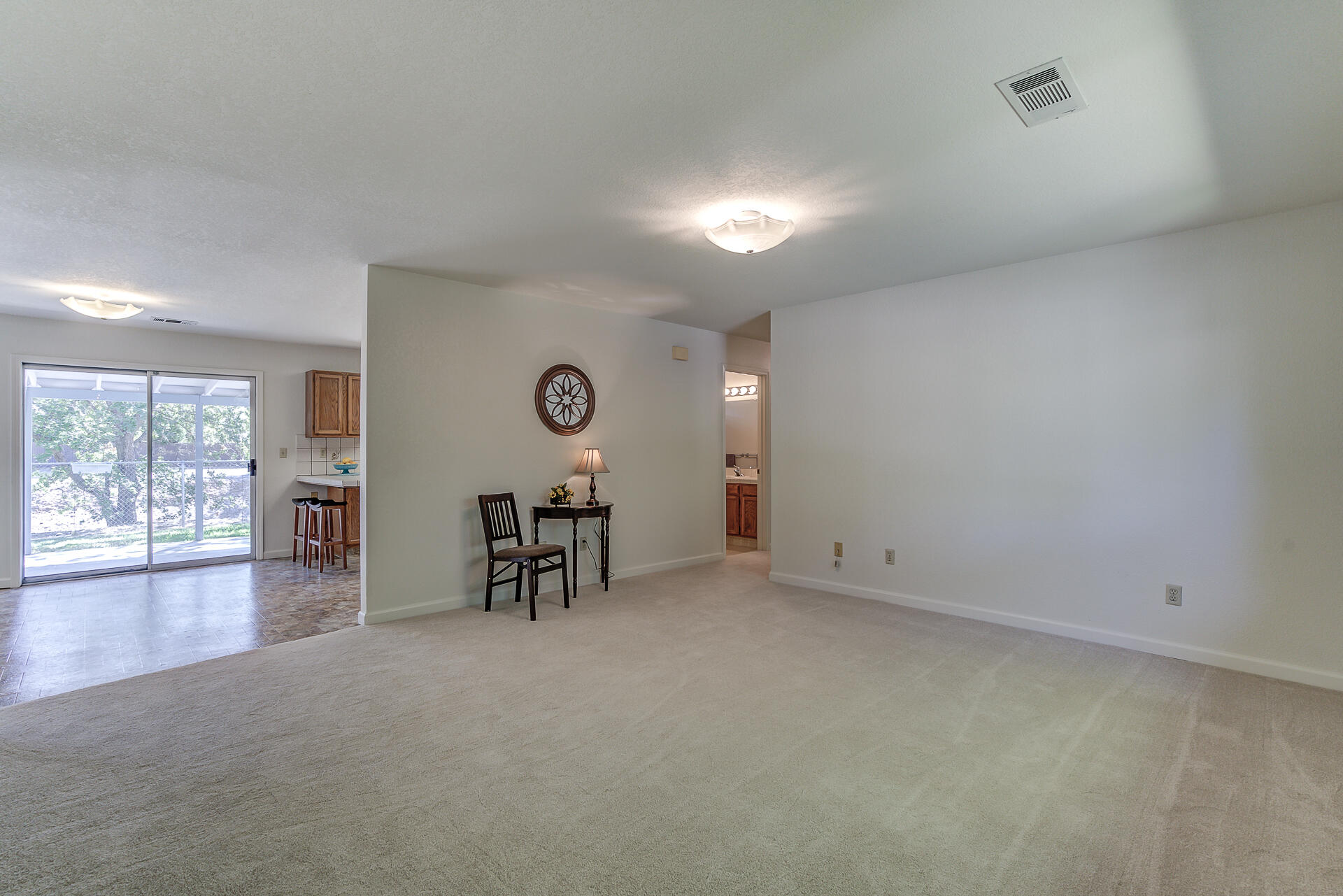 649 Lowe Street Redding, CA 96001 - Photo 3 of 35 an empty room with furniture and windows