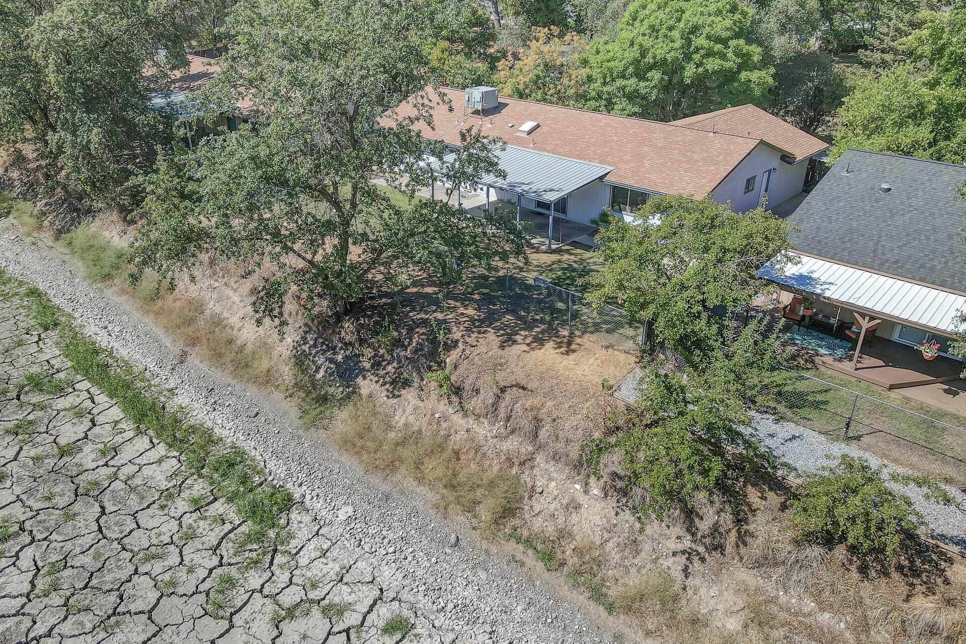649 Lowe Street Redding, CA 96001 - Photo 32 of 35 an aerial view of house with yard and mountain view in back