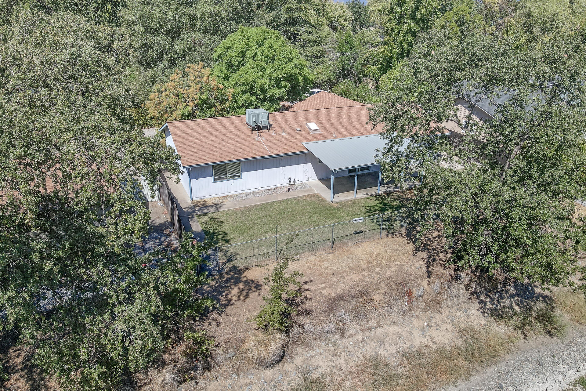 649 Lowe Street Redding, CA 96001 - Photo 33 of 35 an aerial view of a house with a yard