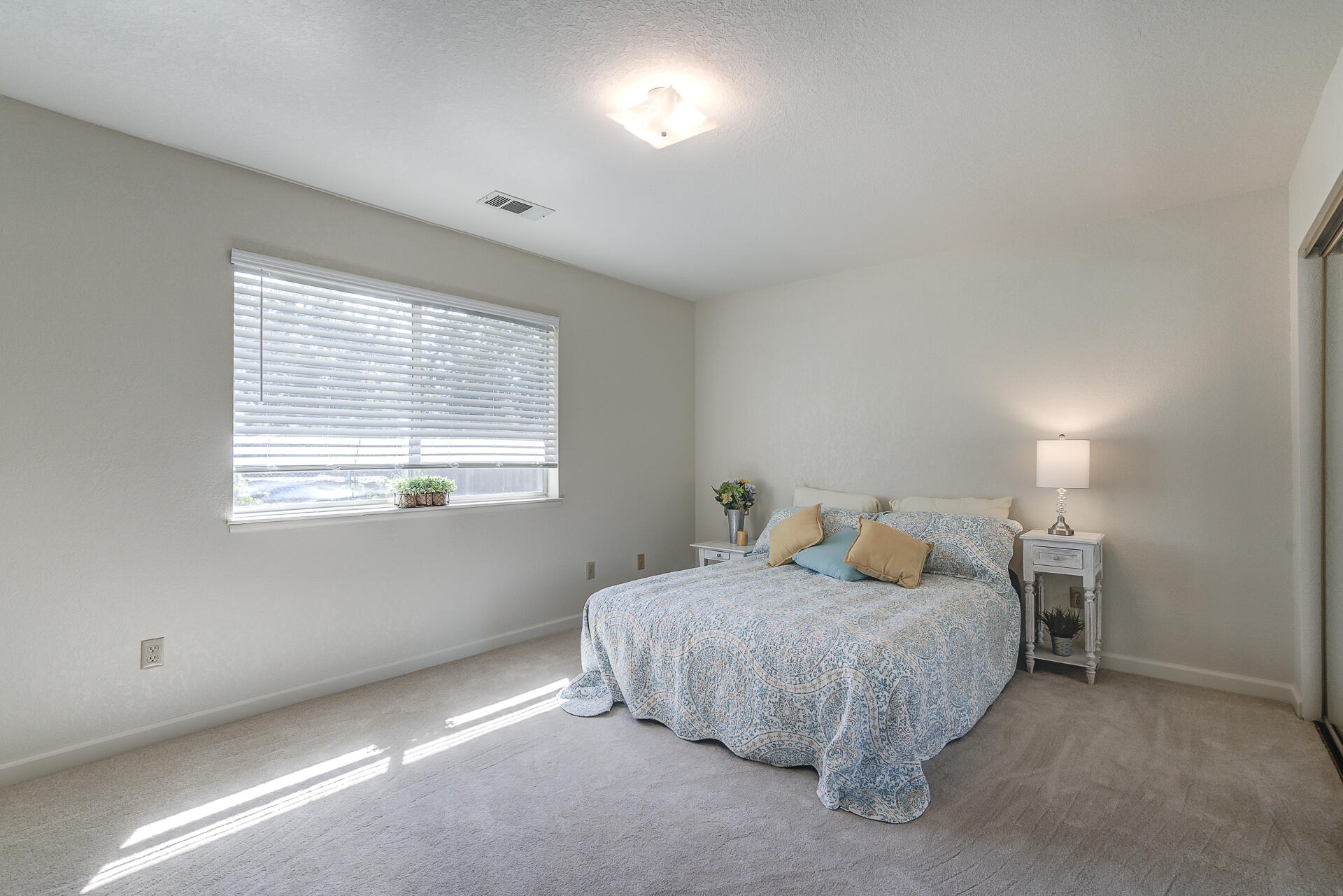 649 Lowe Street Redding, CA 96001 - Photo 10 of 35 a bedroom with a bed and a window