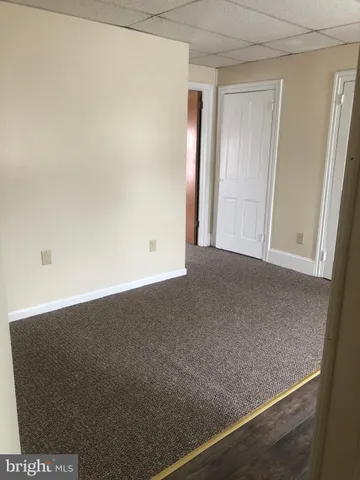 a kitchen with granite countertop a refrigerator a sink a stove a microwave a counter top and cabinets