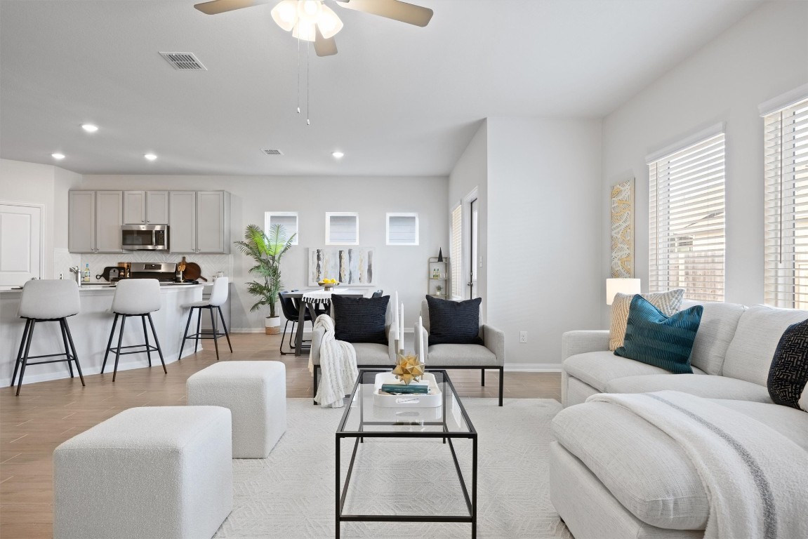 a living room with furniture and a large window