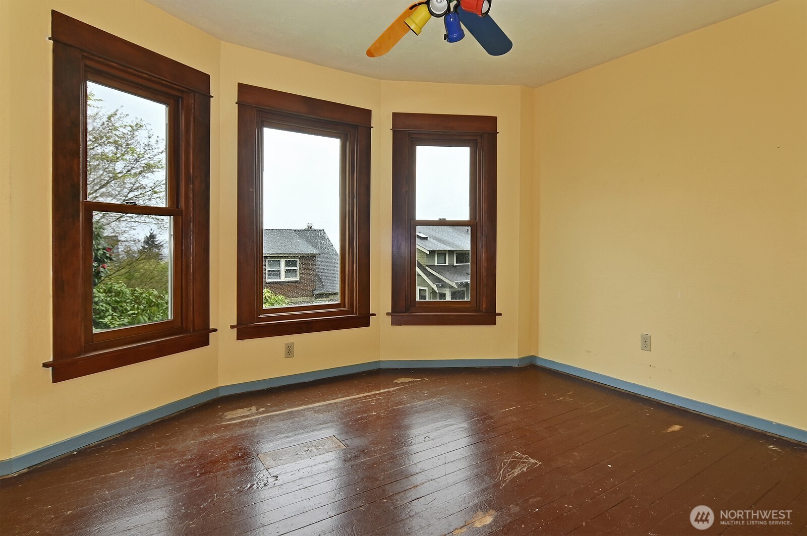 3244 Northwest 64th Street Seattle, WA 98107 - Photo 24 of 32 a view of an empty room with window and wooden floor