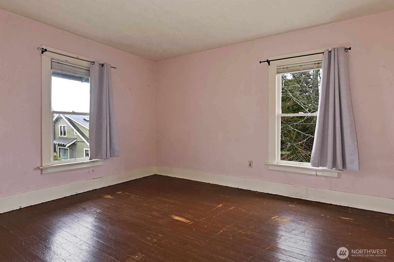 3244 Northwest 64th Street Seattle, WA 98107 - Photo 25 of 32 a view of an empty room with wooden floor and a window