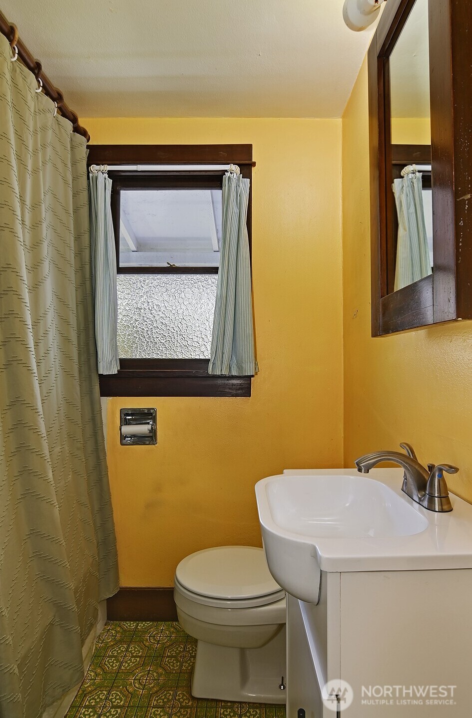 3244 Northwest 64th Street Seattle, WA 98107 - Photo 29 of 32 a bathroom with a toilet sink and mirror
