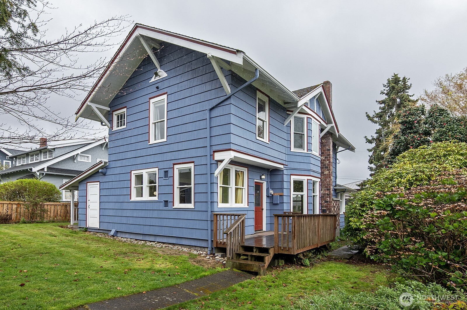 3244 Northwest 64th Street Seattle, WA 98107 - Photo 5 of 32 a front view of a house with a yard