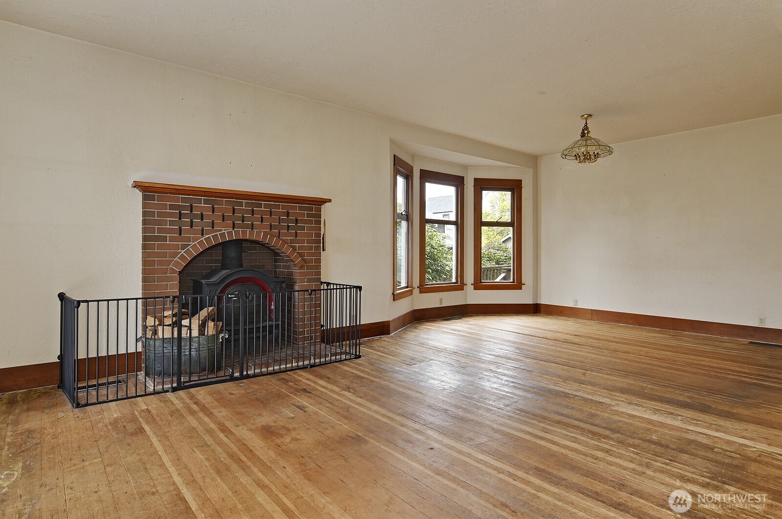 3244 Northwest 64th Street Seattle, WA 98107 - Photo 8 of 32 a view of empty room with wooden floor and fan