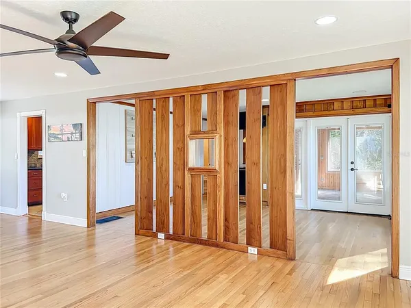 a view of empty room with a flat screen tv and a fireplace