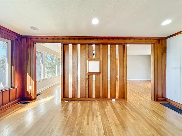 a kitchen with stainless steel appliances granite countertop a refrigerator a stove and a sink