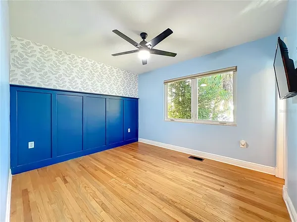 a view of a house with backyard and porch