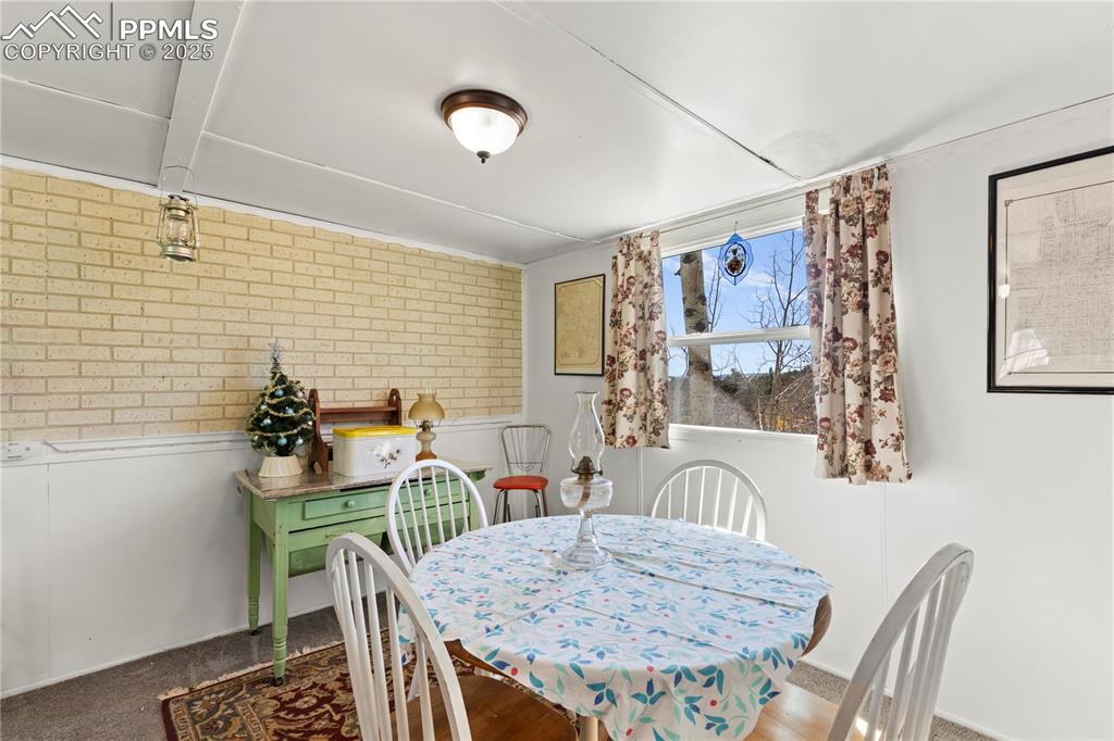 374 Fern Road Woodland Park, CO 80863 - Photo 13 of 31 a dining room with furniture and window