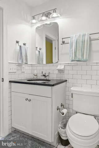 a bedroom with a bed and a mirror