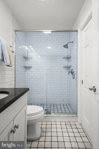 a living room with furniture and a mirror