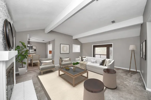 an empty room with a fireplace and window