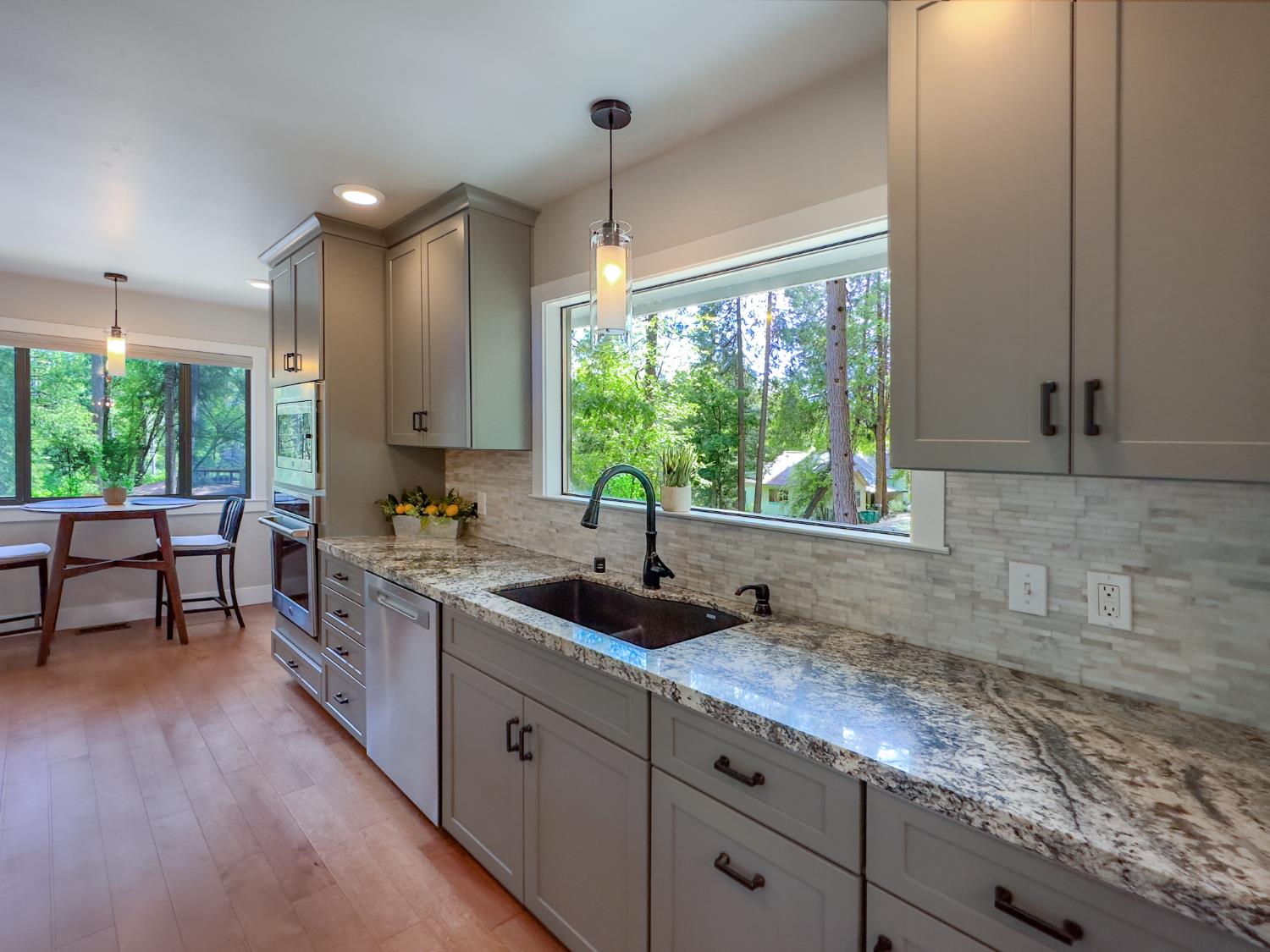 157 Grove Street Nevada City, CA 95959 - Photo 18 of 55 a kitchen with sink a window and chairs