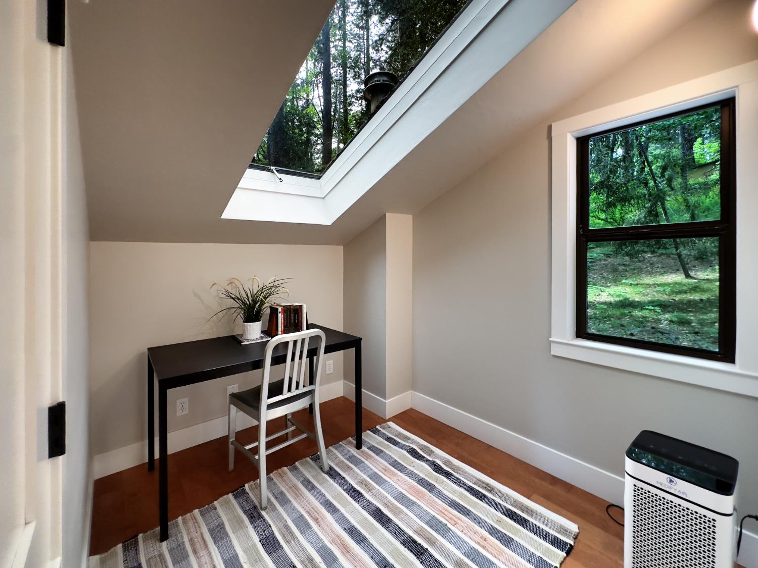 157 Grove Street Nevada City, CA 95959 - Photo 38 of 55 a view of a workspace with furniture and a window
