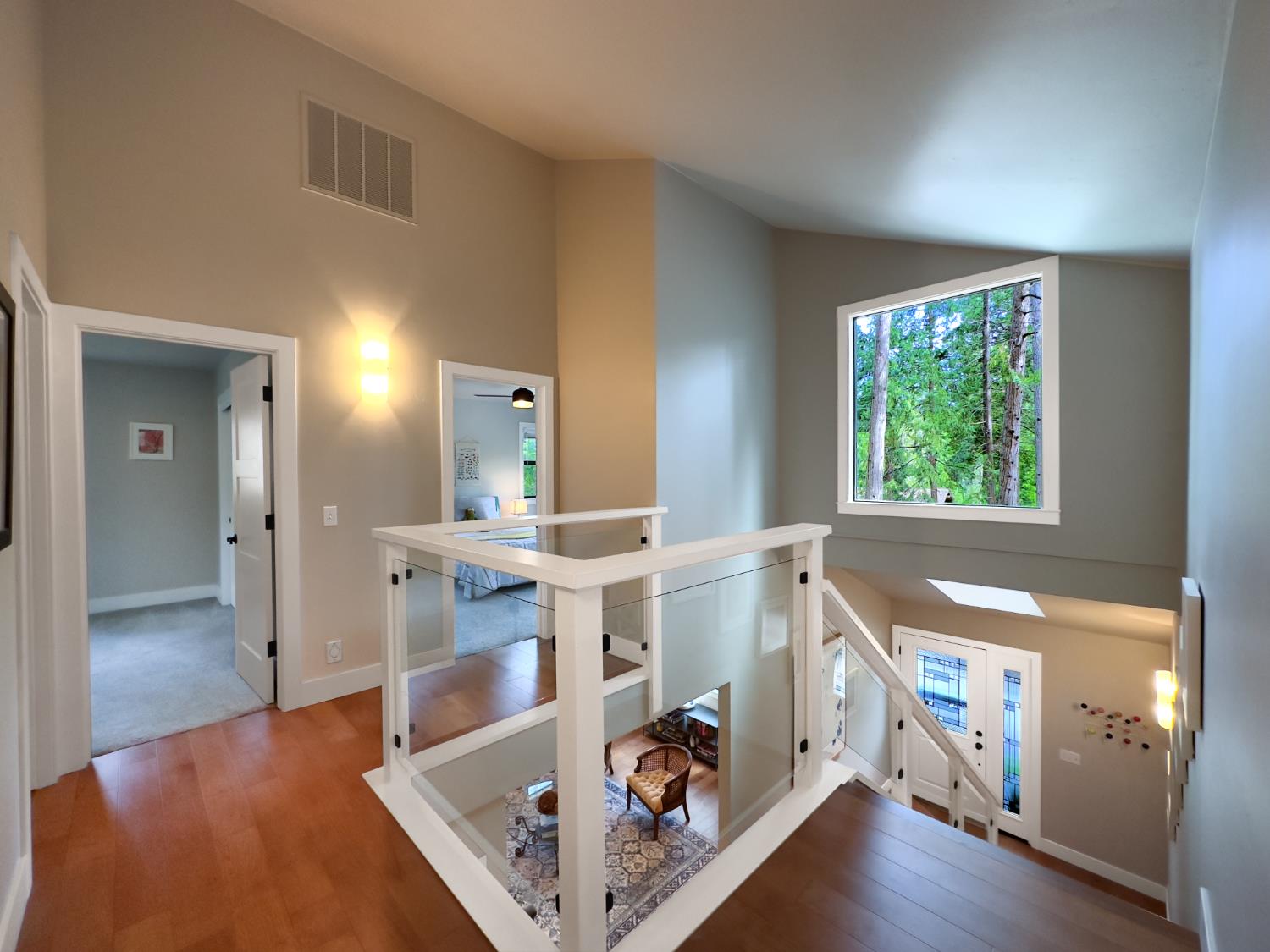 157 Grove Street Nevada City, CA 95959 - Photo 39 of 55 a view of a hallway to a livingroom with furniture hardwood floor and a large window