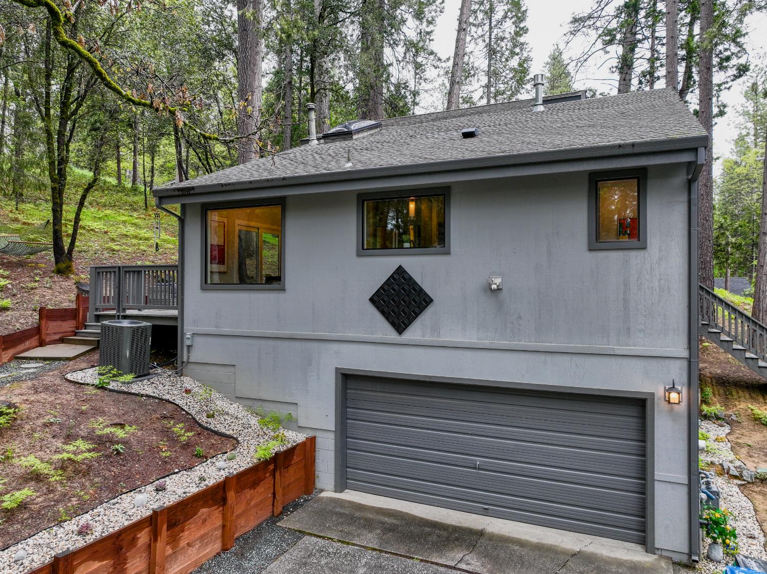 157 Grove Street Nevada City, CA 95959 - Photo 48 of 55 a front view of a house with large trees