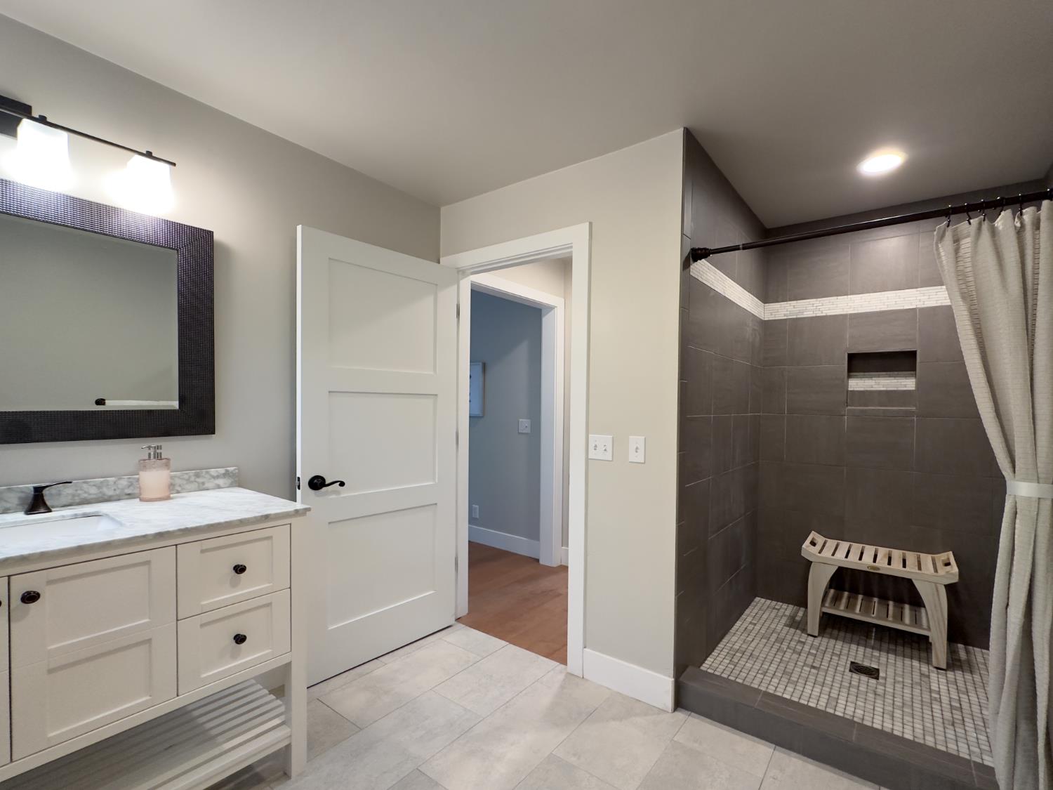 157 Grove Street Nevada City, CA 95959 - Photo 5 of 55 a en suite bathroom with a double vanity sink and a mirror