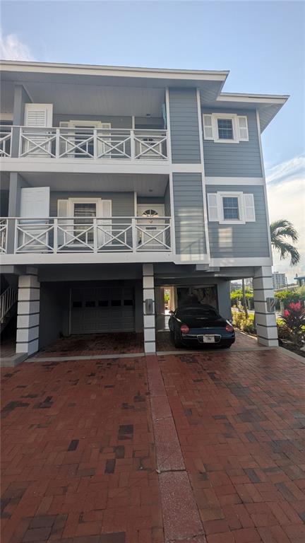 a living room with stainless steel appliances granite countertop a stove and a fireplace