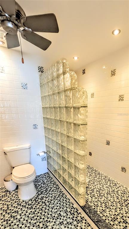 1546 Stickney Point Road, Unit 501 Sarasota, FL 34231 - Photo 18 of 34 a bathroom with a toilet and a shower