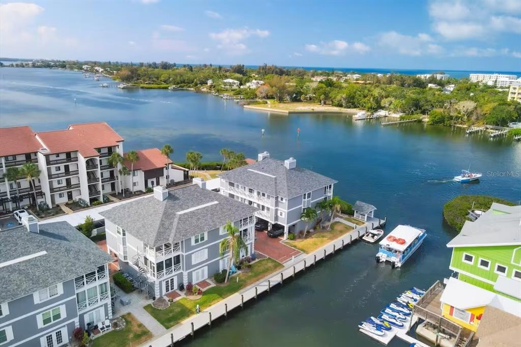1546 Stickney Point Road, Unit 501 Sarasota, FL 34231 - Photo 34 of 34 an aerial view of a house with a lake view