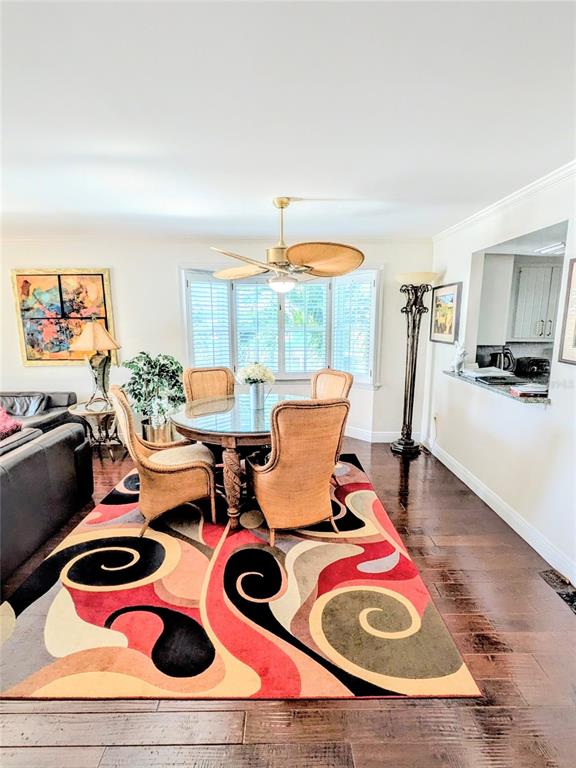1546 Stickney Point Road, Unit 501 Sarasota, FL 34231 - Photo 4 of 34 a living room with furniture and a wooden floor