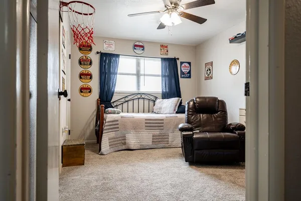 a bedroom with furniture and a window