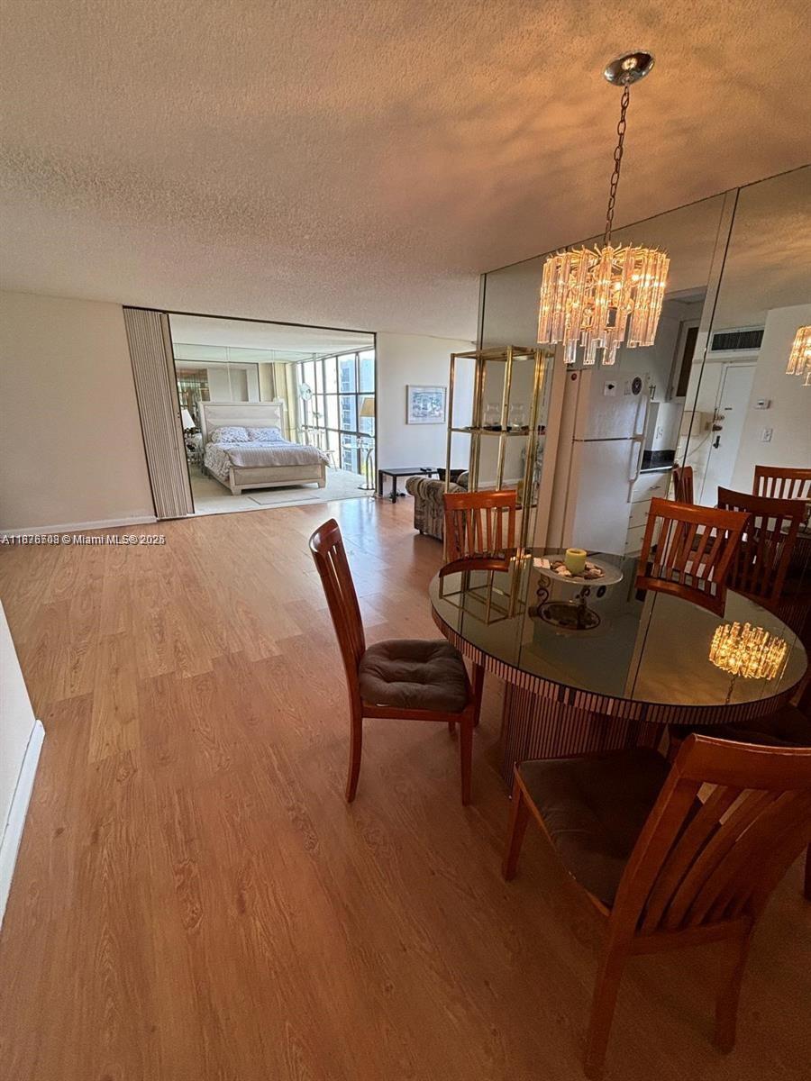 17011 North Bay Road, Unit 805 Sunny Isles Beach, FL 33160 - Photo 5 of 25 a dining room with furniture and window