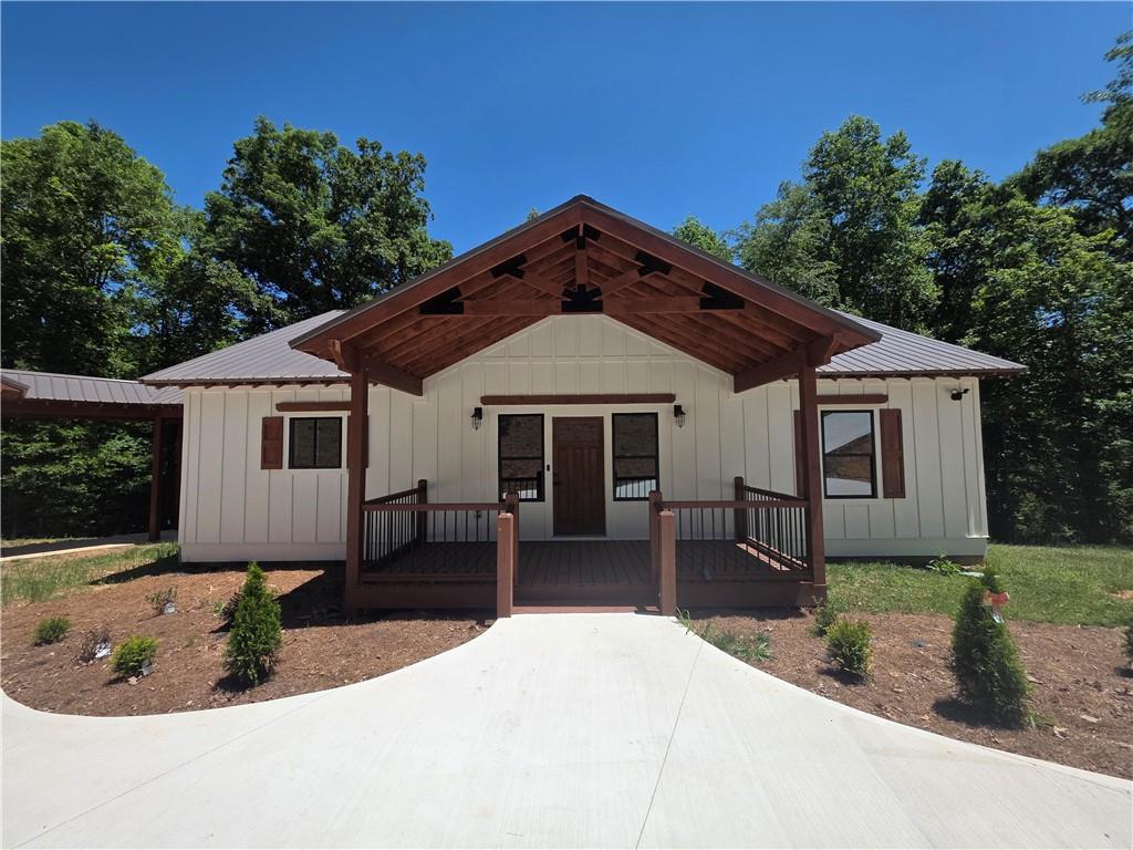 1217 Youngs Farm Road Cedartown, GA 30125 - Photo 3 of 29 a front view of a house with a yard