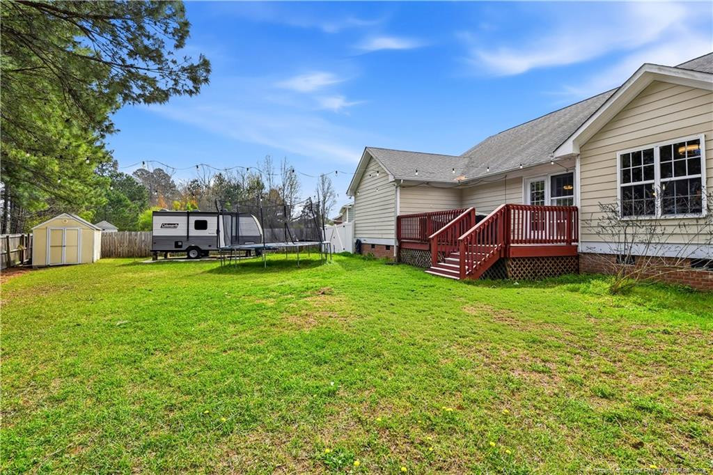 212 Lennox Loop Raeford, NC 28376 - Photo 44 of 47 a view of a house with backyard and porch