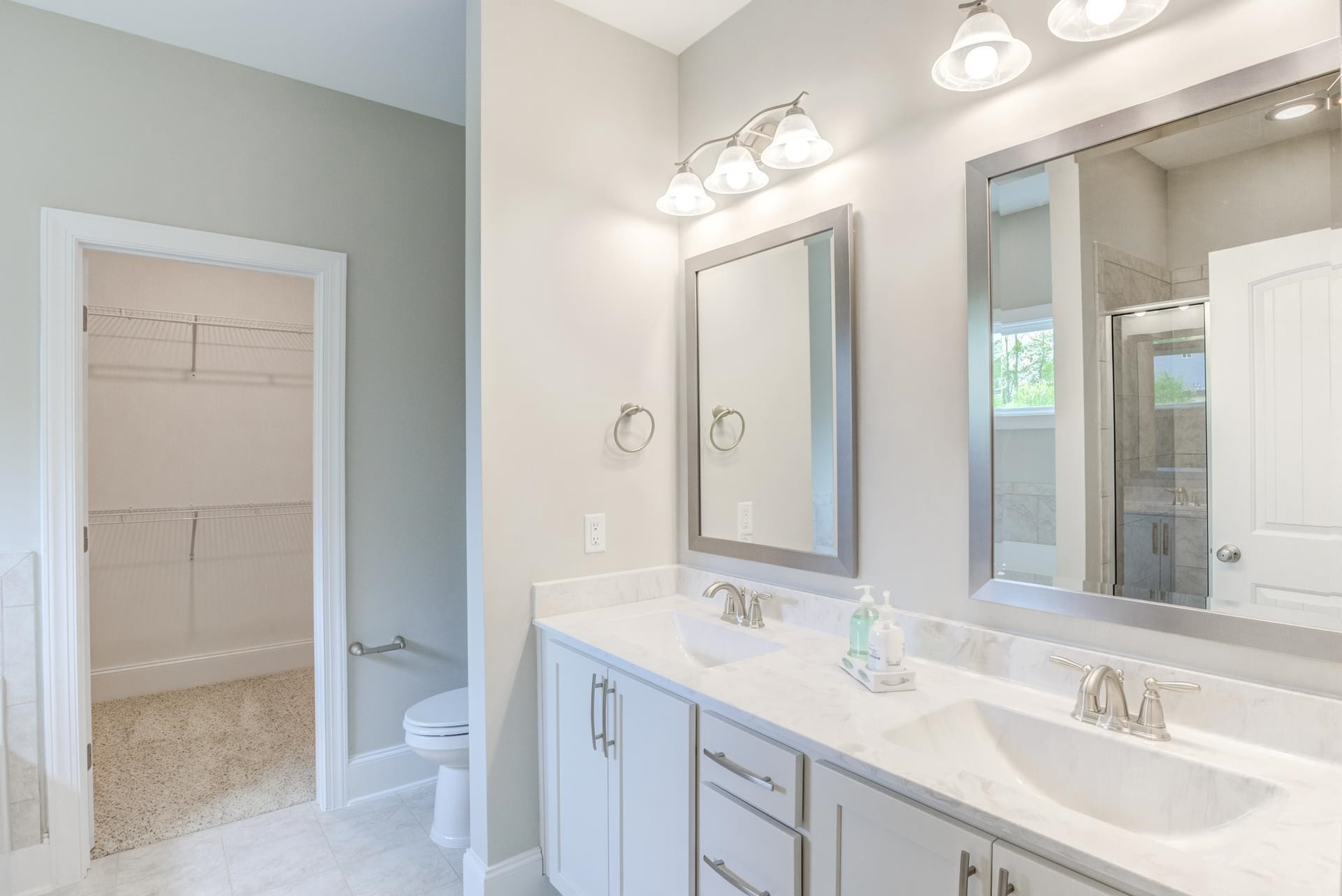 375 Howards Crossing Drive Wendell, NC 27591 - Photo 12 of 16 a bathroom with a sink a toilet and shower