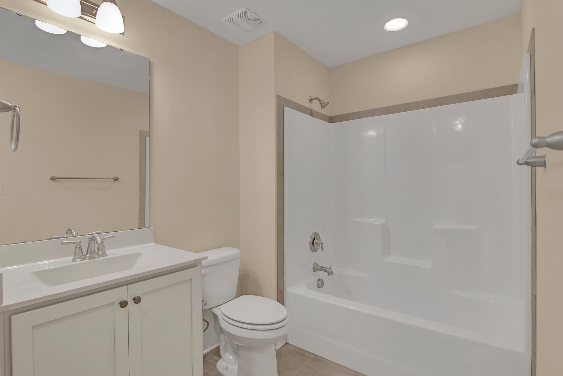 375 Howards Crossing Drive Wendell, NC 27591 - Photo 14 of 16 a bathroom with a bathtub toilet sink vanity and a shower