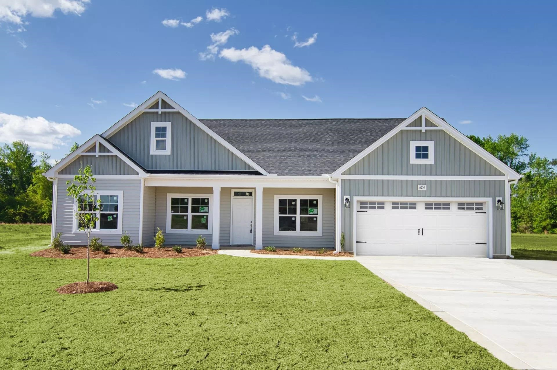 375 Howards Crossing Drive Wendell, NC 27591 - Photo 16 of 16 a front view of a house with a yard and potted plants