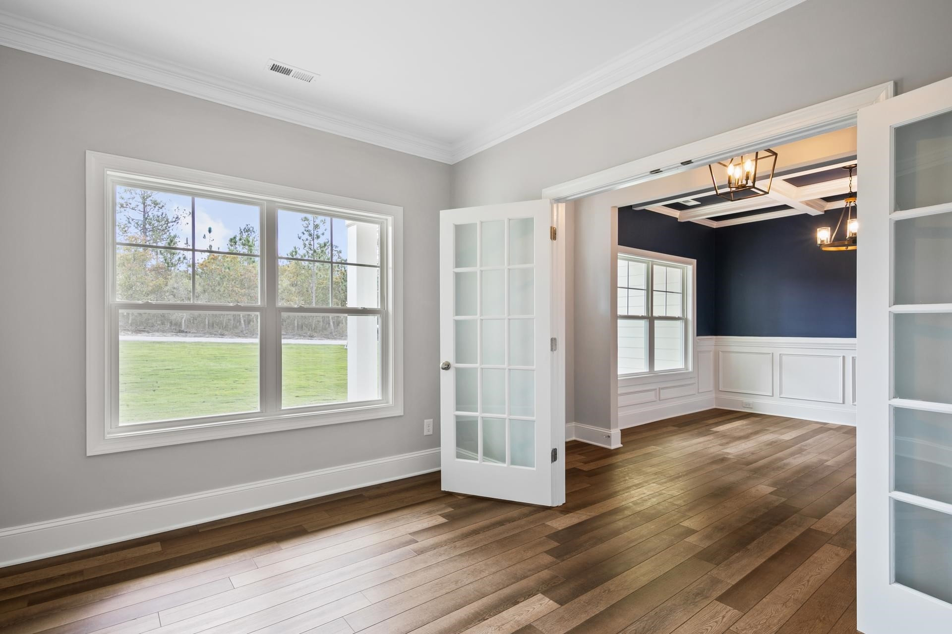 375 Howards Crossing Drive Wendell, NC 27591 - Photo 4 of 16 a view of an empty room with wooden floor and a window