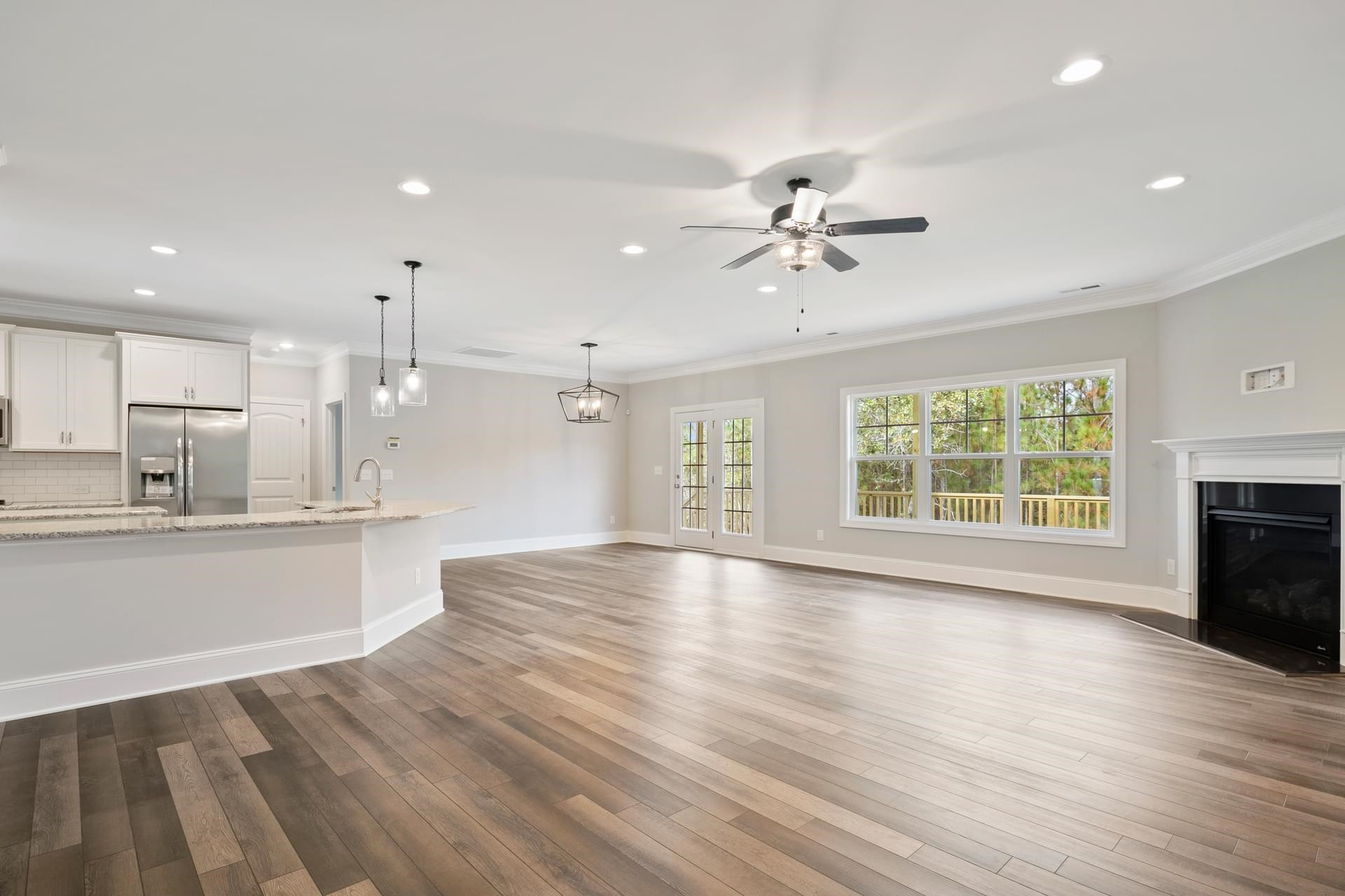 375 Howards Crossing Drive Wendell, NC 27591 - Photo 5 of 16 a view of an empty room with window and wooden floor