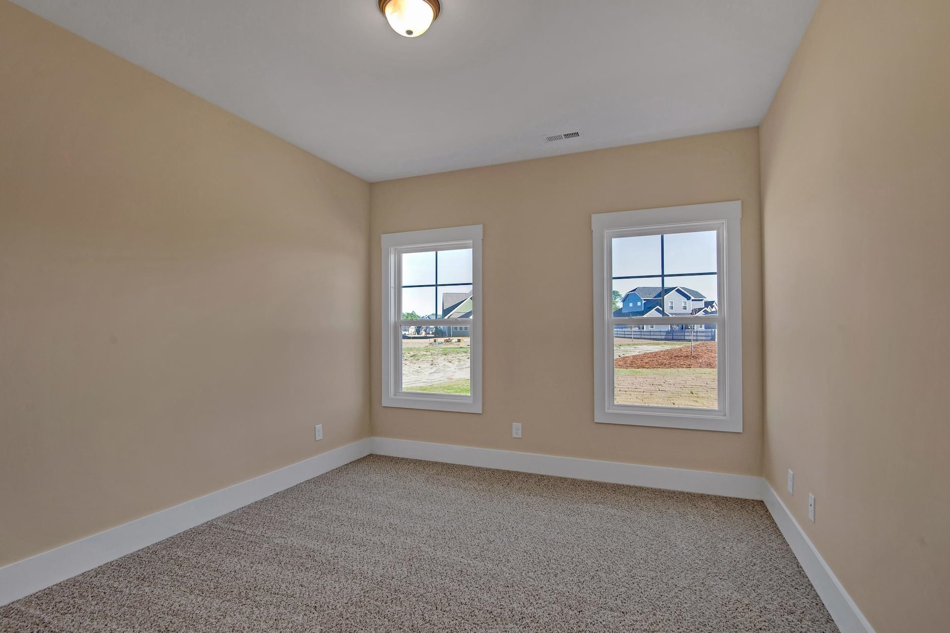 375 Howards Crossing Drive Wendell, NC 27591 - Photo 8 of 16 an empty room with windows