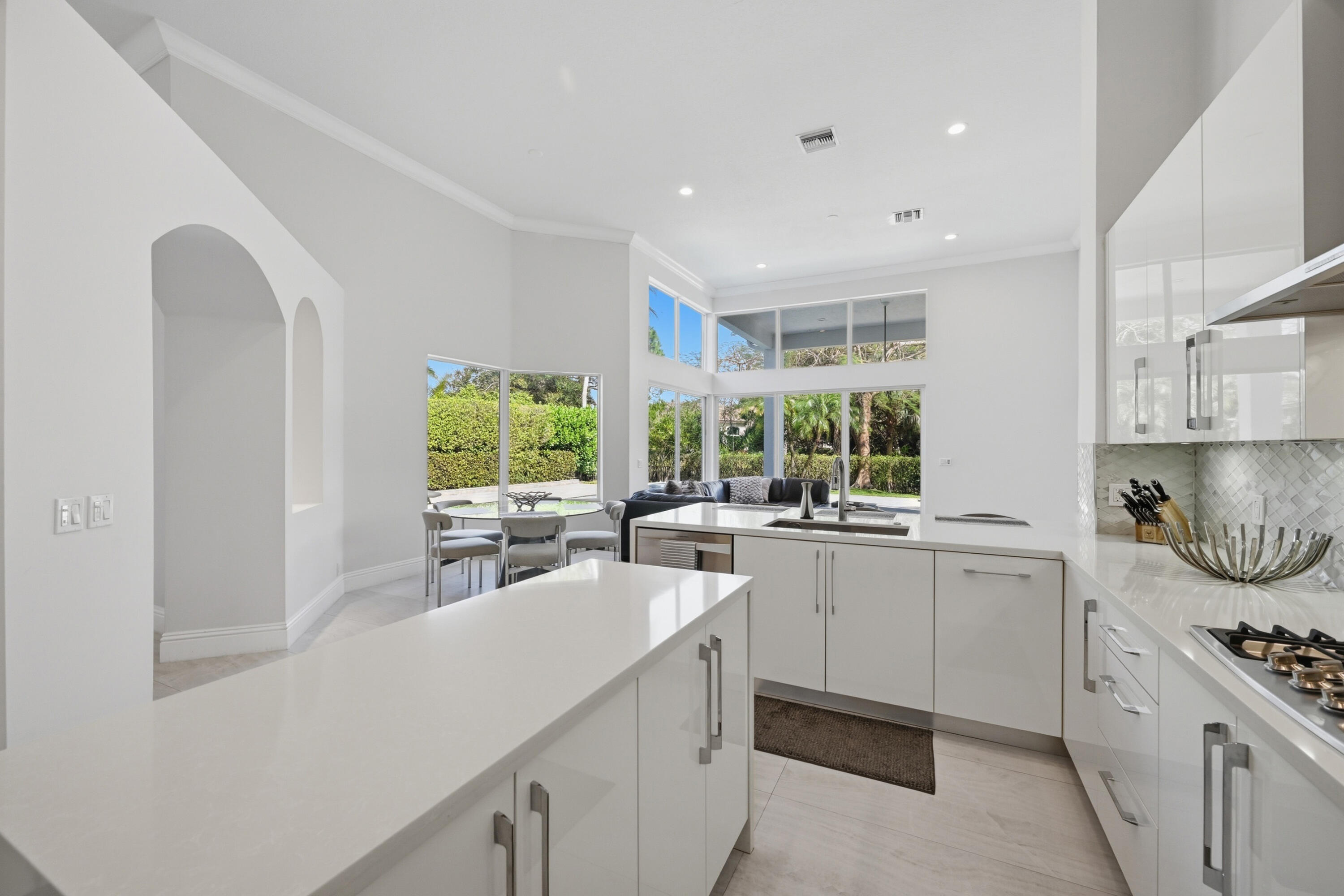5006 Northwest 24th Circle Boca Raton, FL 33431 - Photo 12 of 52 a kitchen with a sink stove and cabinets