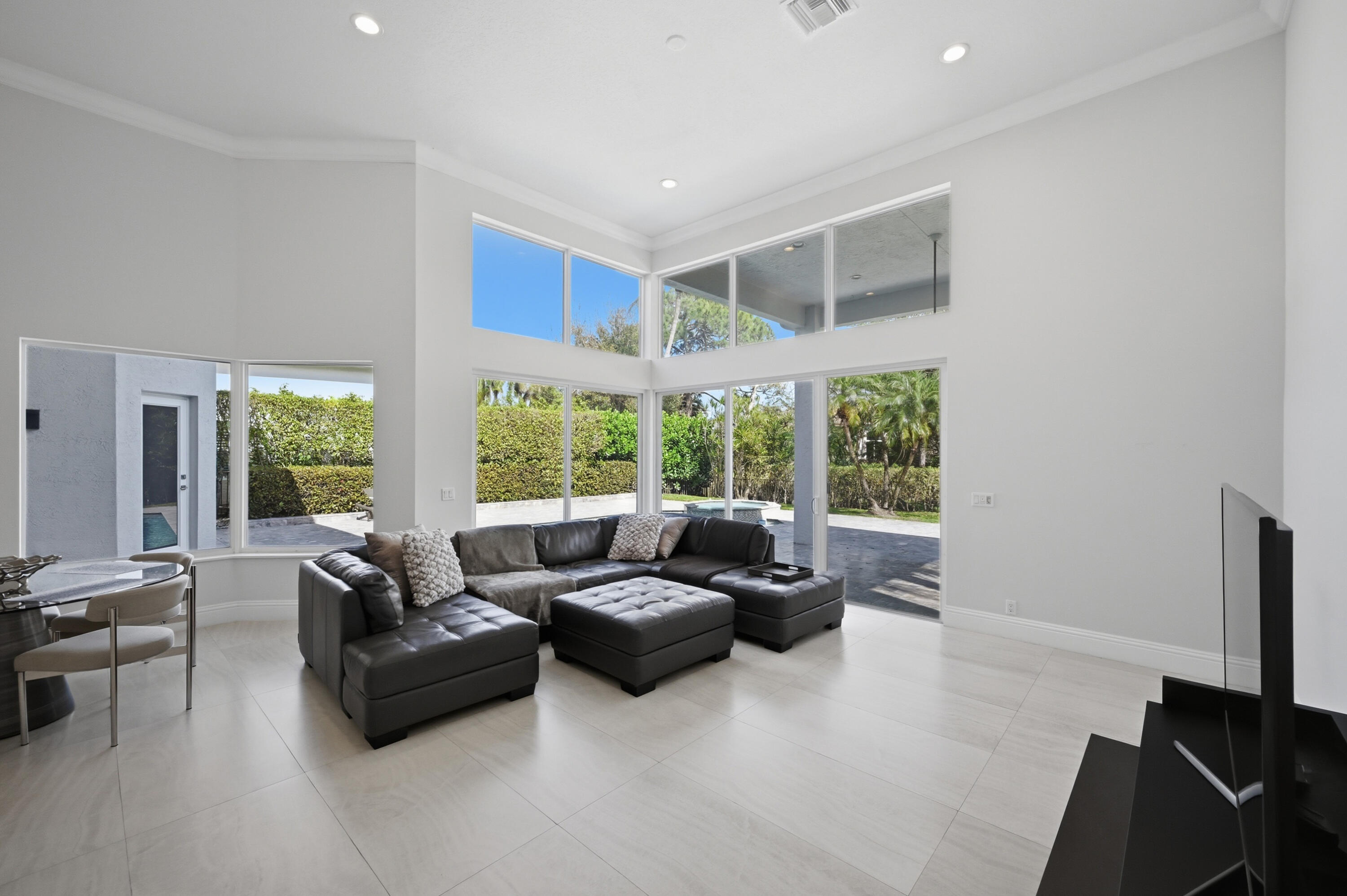 5006 Northwest 24th Circle Boca Raton, FL 33431 - Photo 16 of 52 a living room with furniture and a flat screen tv