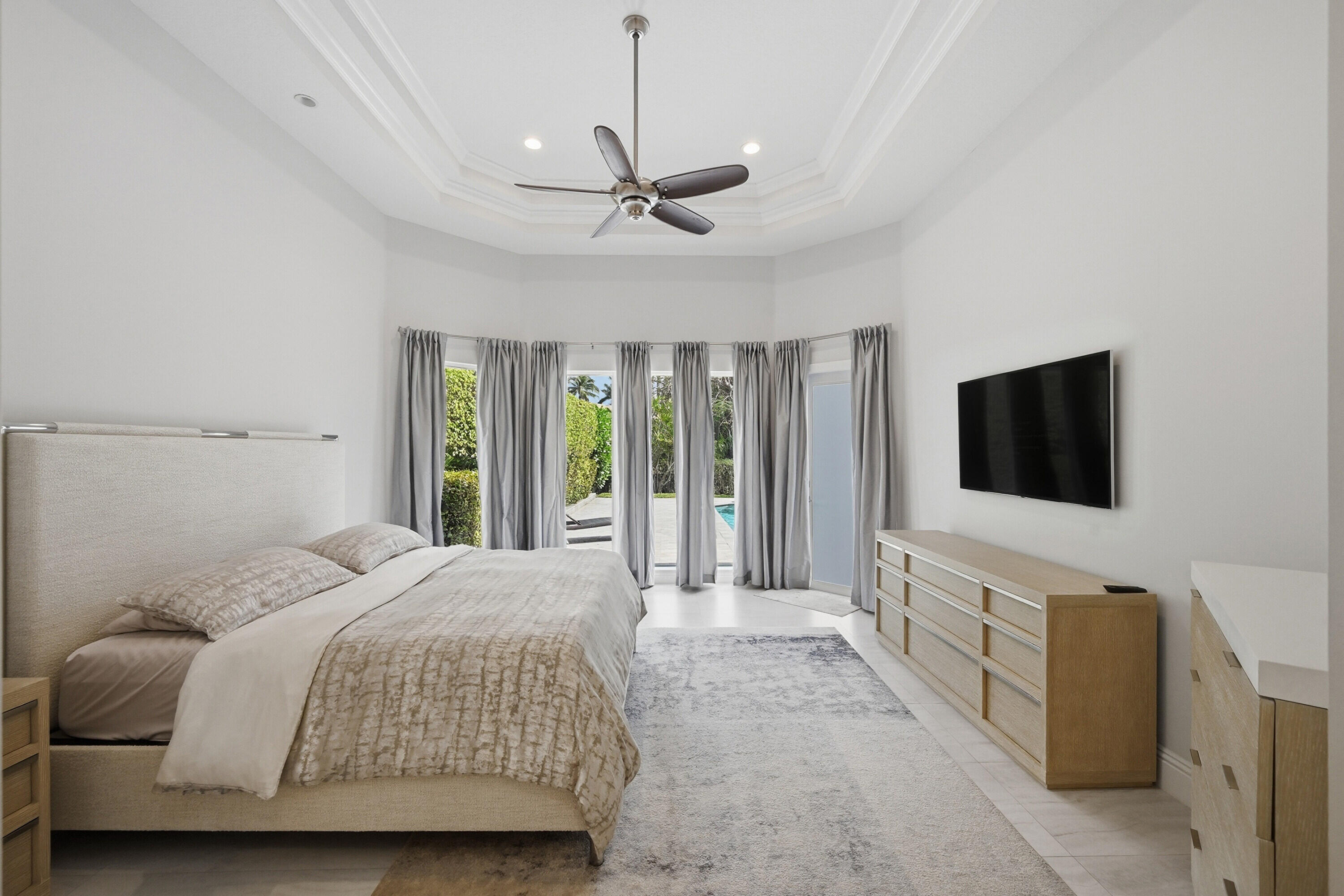 5006 Northwest 24th Circle Boca Raton, FL 33431 - Photo 19 of 52 a bedroom with a bed and a flat screen tv