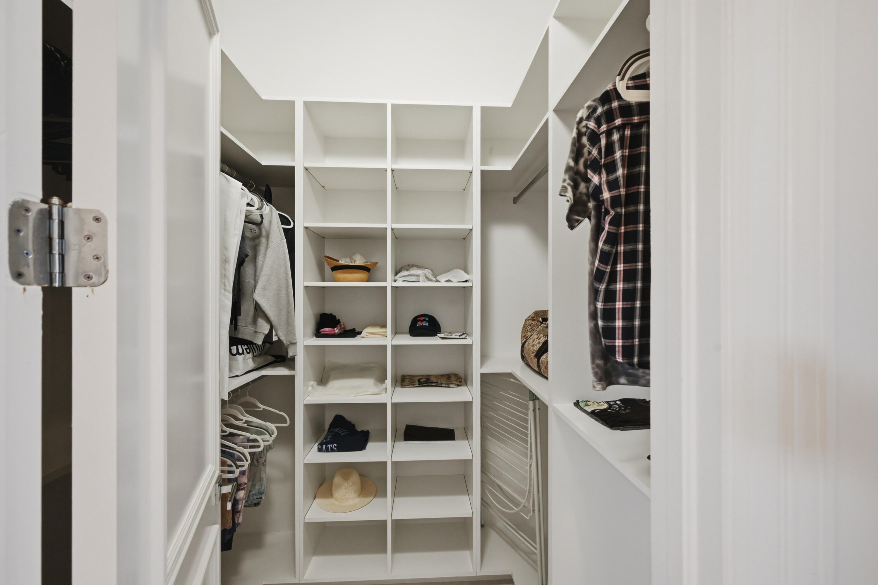 5006 Northwest 24th Circle Boca Raton, FL 33431 - Photo 26 of 52 a view of walk in closet with empty racks