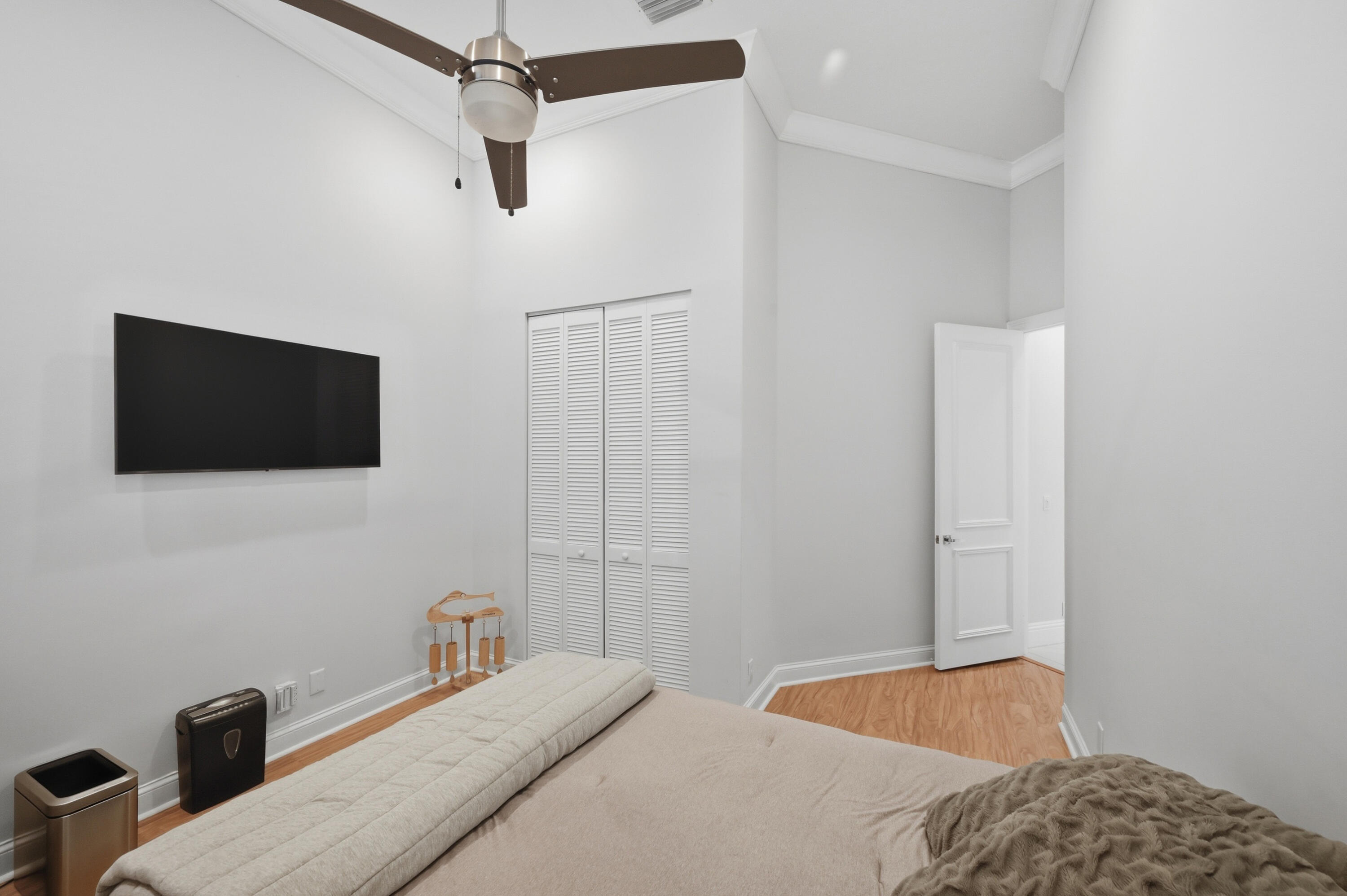 5006 Northwest 24th Circle Boca Raton, FL 33431 - Photo 28 of 52 a bedroom with a bed and a flat screen tv