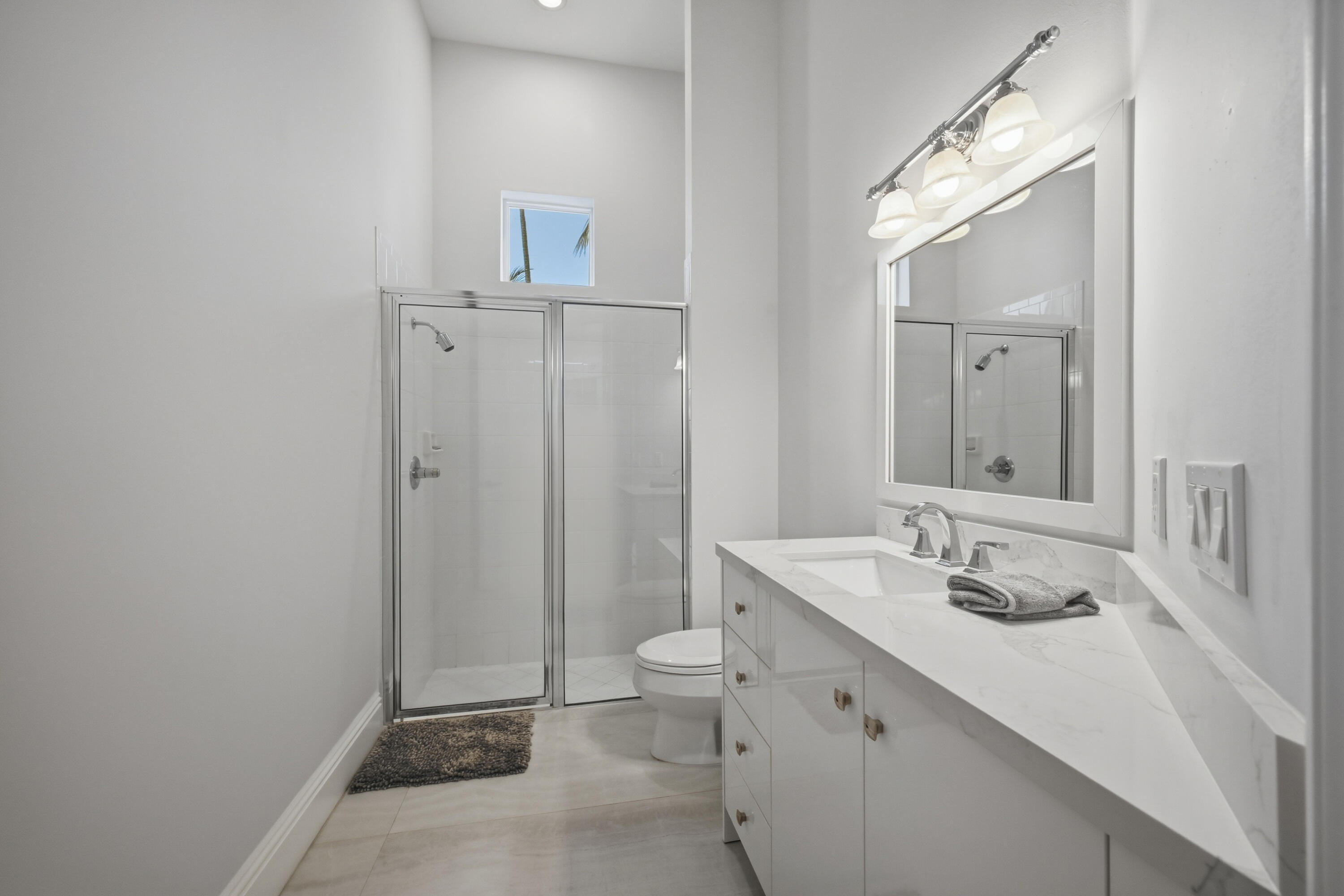 5006 Northwest 24th Circle Boca Raton, FL 33431 - Photo 30 of 52 a bathroom with a sink a toilet and shower